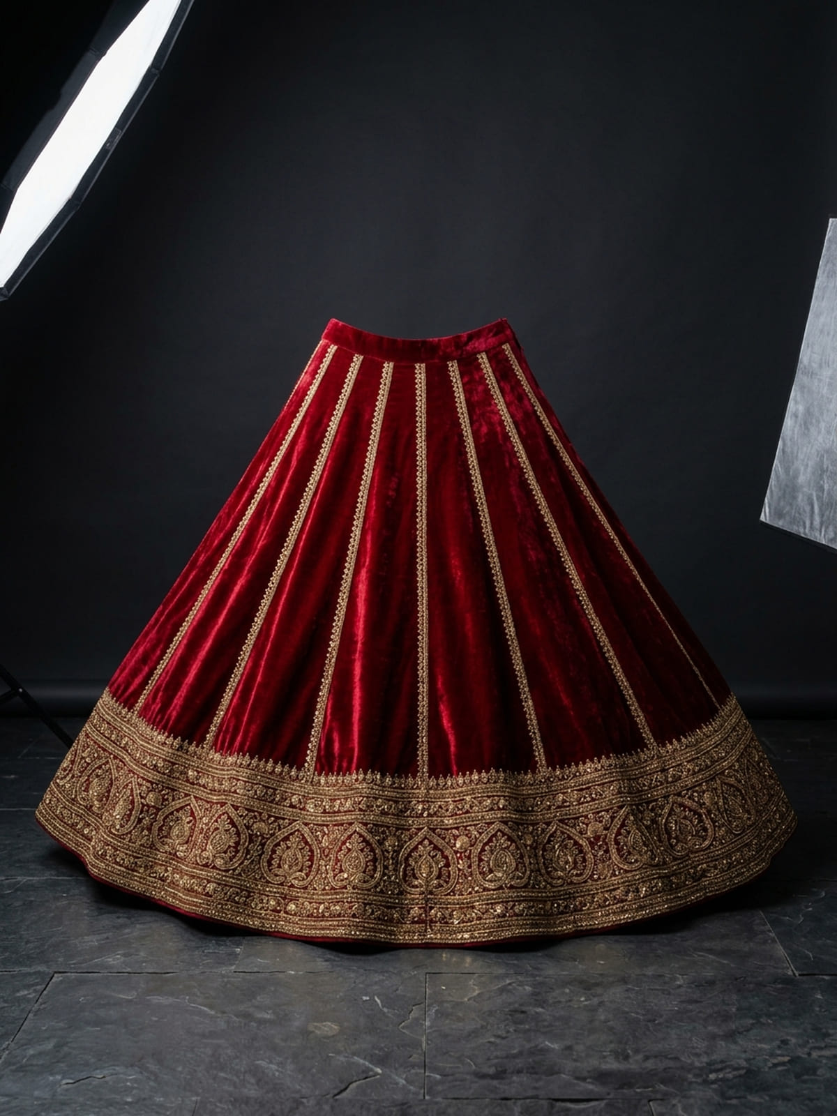 Kanjivaram tissue and Banarasi khaddi brocade silks layered on dark stone