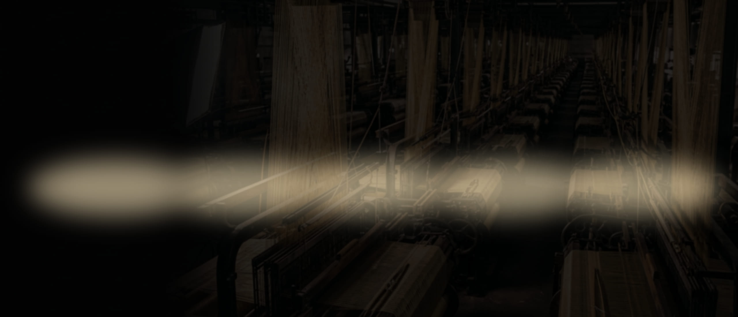 Backlit fabric inspection tables on a textile quality control floor